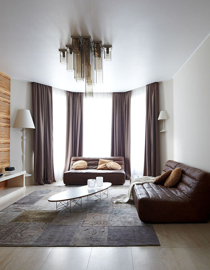 Stretch ceilings in the living room - photo