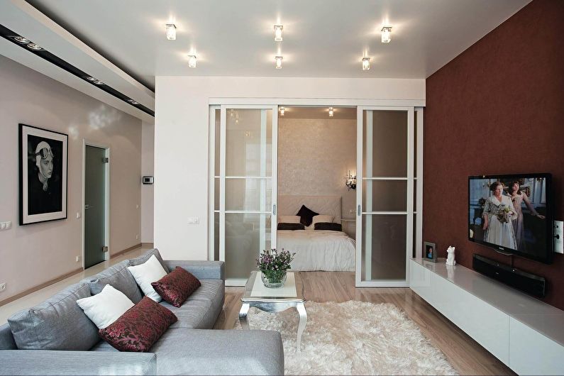 Interior design of a living room combined with a bedroom - photo