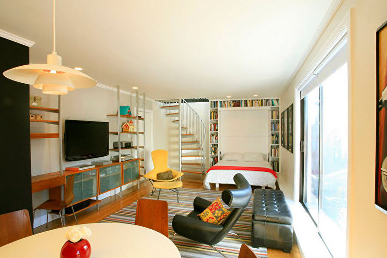Interior design of a living room combined with a bedroom - photo
