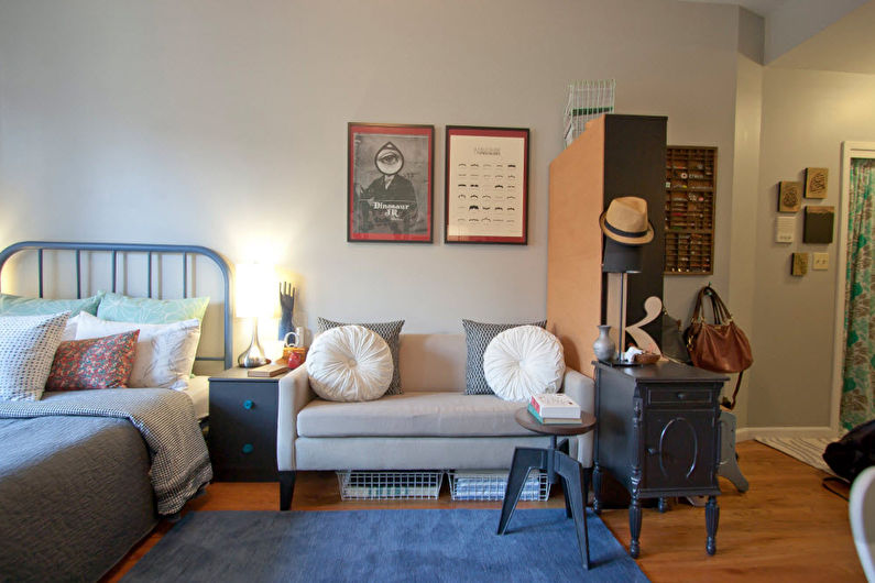 Interior design of a living room combined with a bedroom - photo