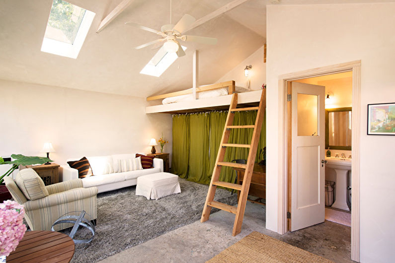 Interior design of a living room combined with a bedroom - photo