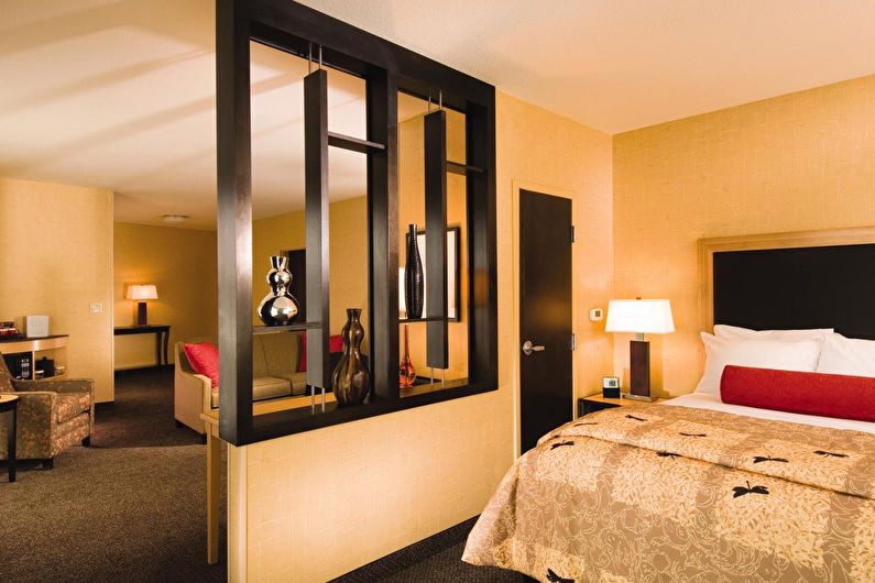 Interior design of a living room combined with a bedroom - photo