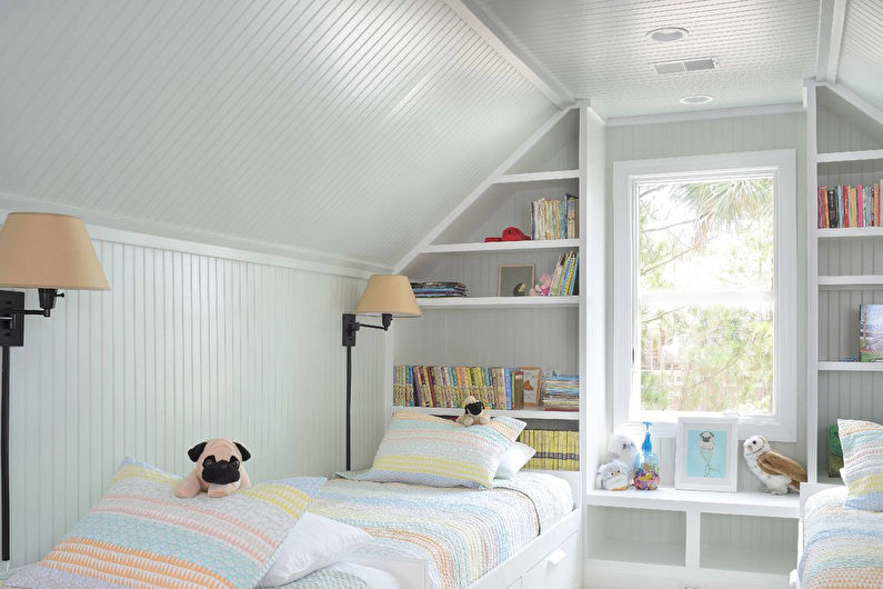 Interior design of a children's room in the attic - photo