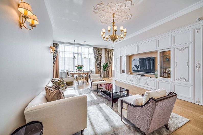 The interior design of the living room in a classic style - photo