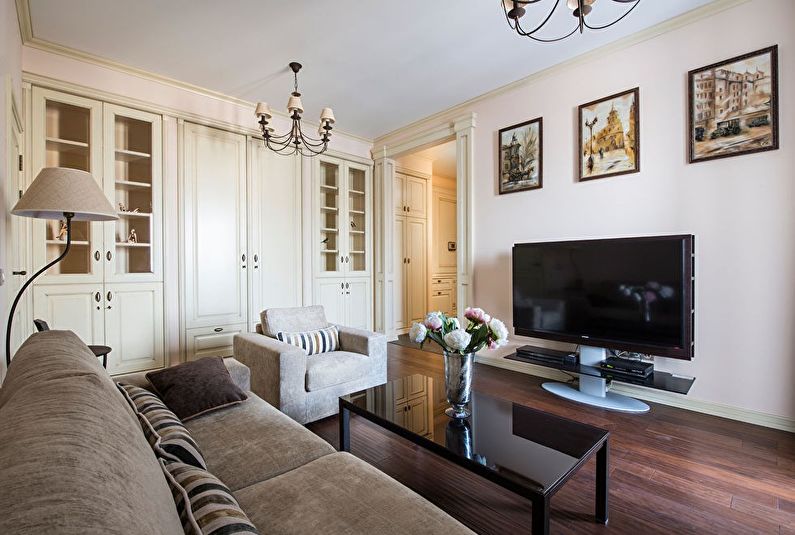 The interior design of the living room in a classic style - photo