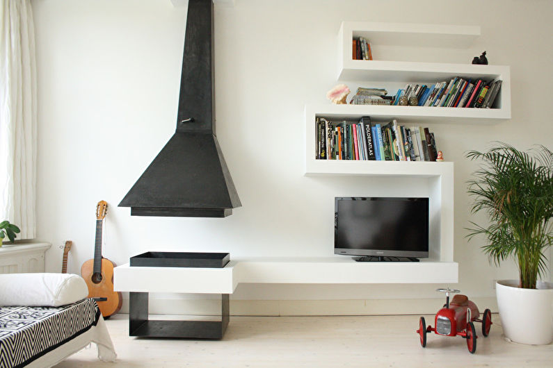 Wall with TV - TV in the living room with fireplace