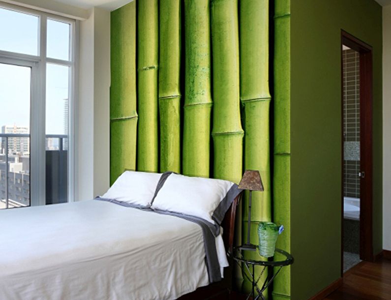 Green photo wallpaper in the bedroom