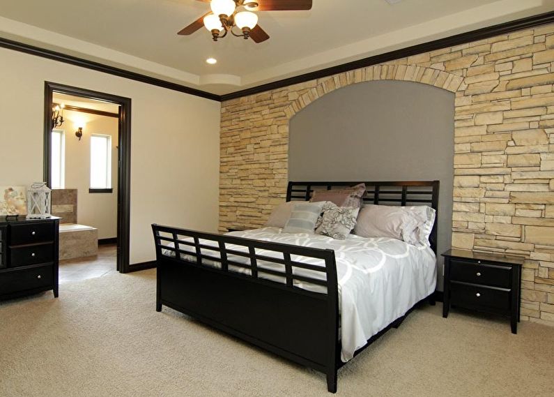 Decorative stone in the bedroom interior - photo