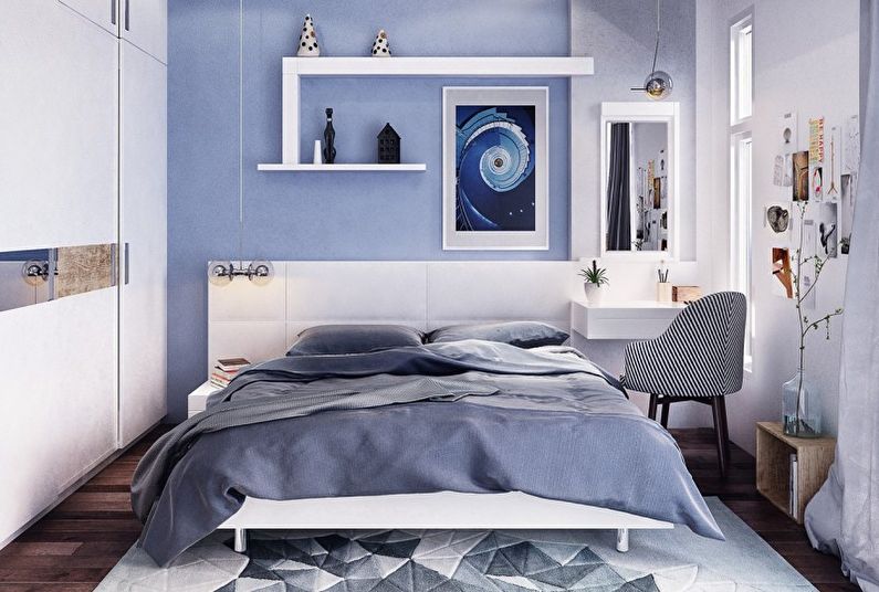 Design of a small bedroom in blue tones - photo