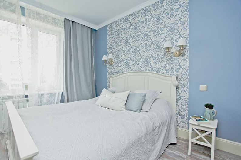 Design of a small bedroom in blue tones - photo