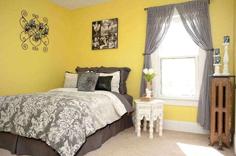 Design of a small bedroom in yellow tones - photo