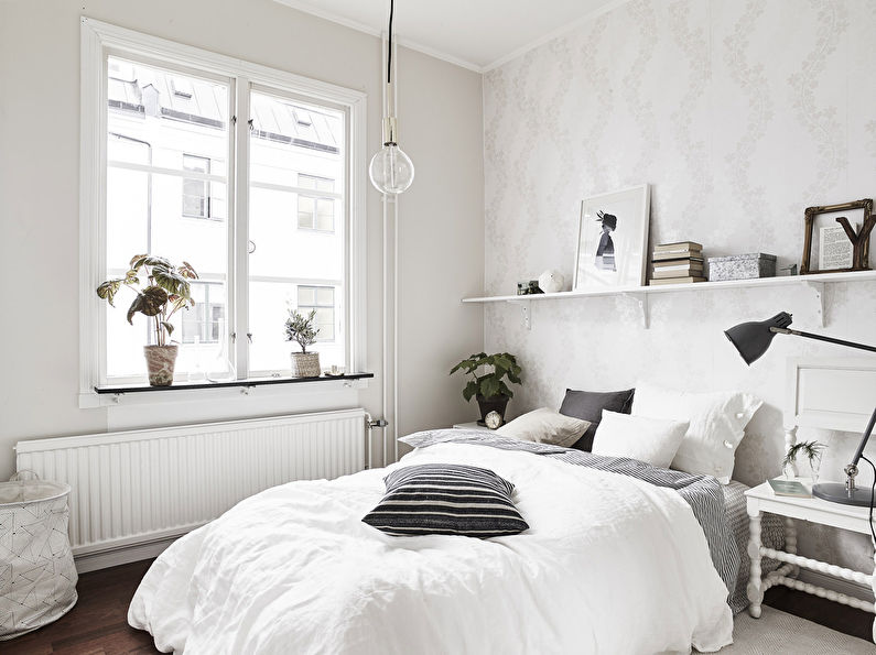 Furniture arrangement in a small square bedroom - photo