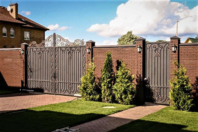 Stone fence for a private house - photo