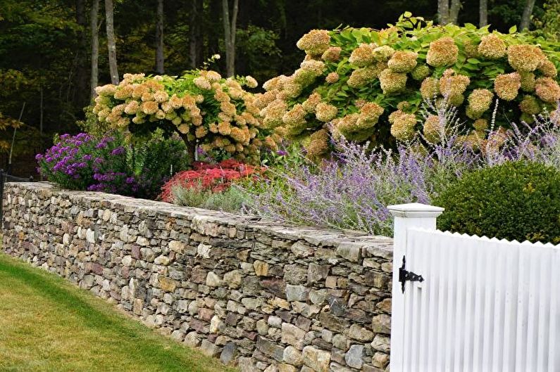 Stone fence for a private house - photo