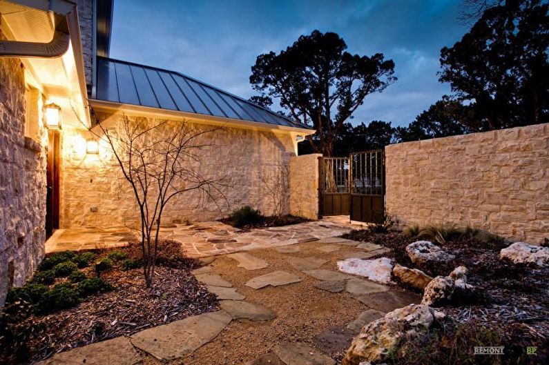 Stone fence for a private house - photo