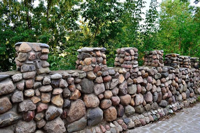 Stone fence for a private house - photo