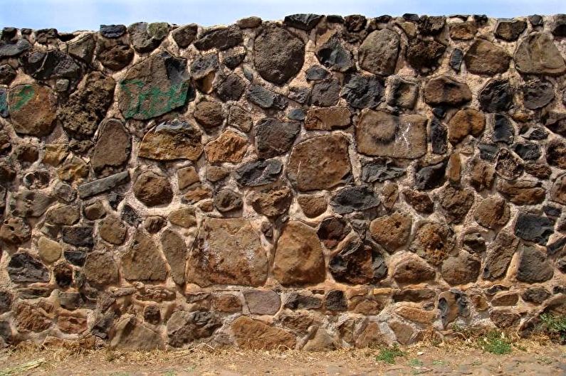 Stone fence for a private house - photo
