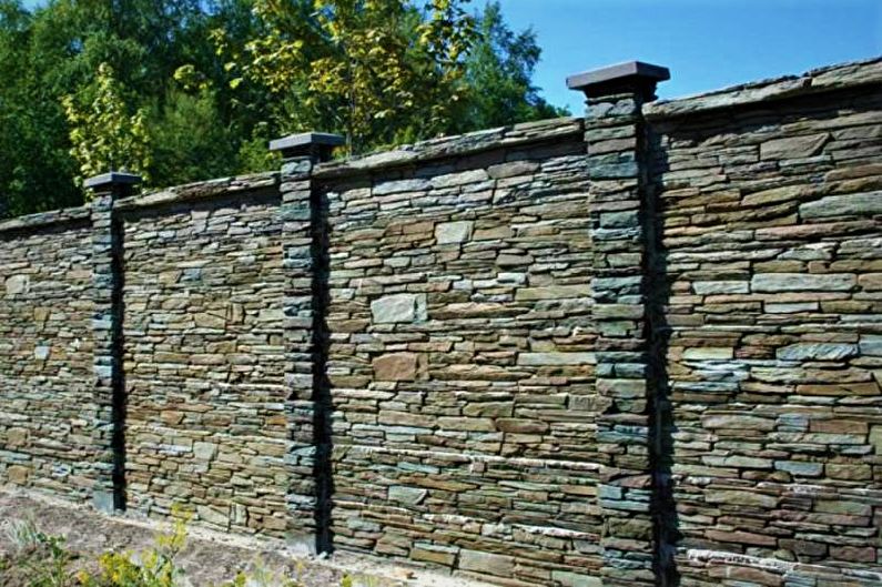 Stone fence for a private house - photo