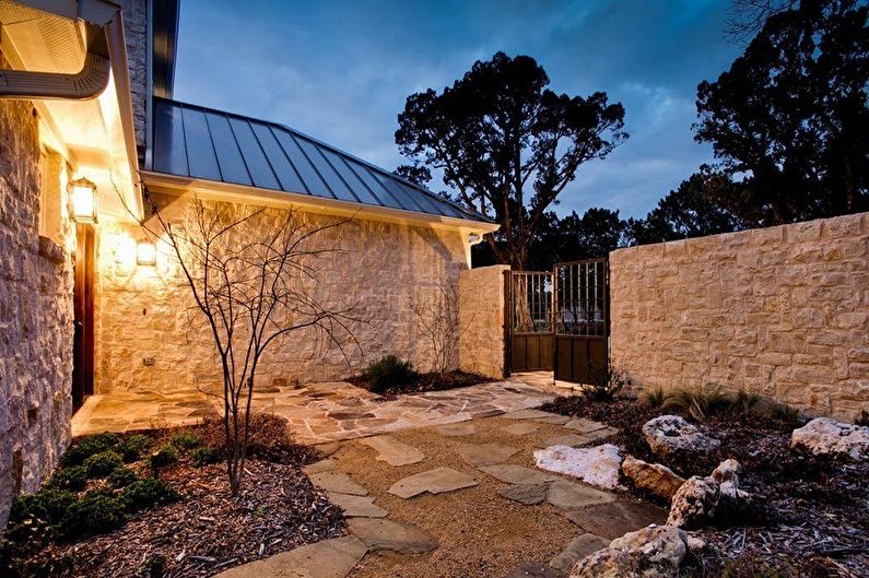 Stone fence for a private house - photo